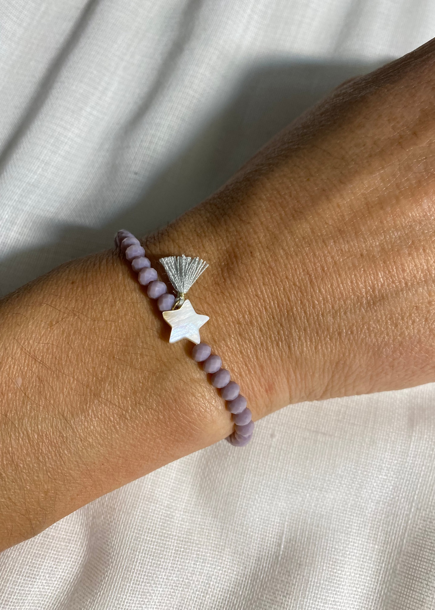 Pulsera estrella pompón